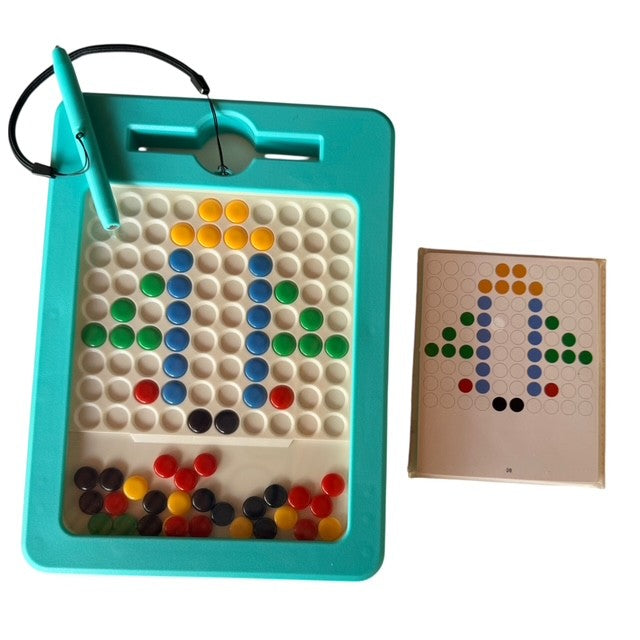 Board game with colorful pegs and a pen, next to a printed board template on a white background.