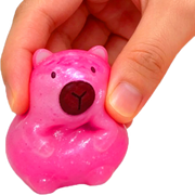 Pink Epic Squish Sugar Cap squeezed between fingers