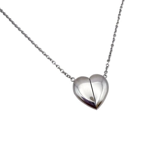 A silver fidget heart-shaped pendant necklace on a delicate silver chain, displayed against a clean white background.