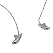 A silver-toned star shaped fidget necklace with a unique, stylized pendant shaped like a stylized bird or fish head, displayed on a clean white background.