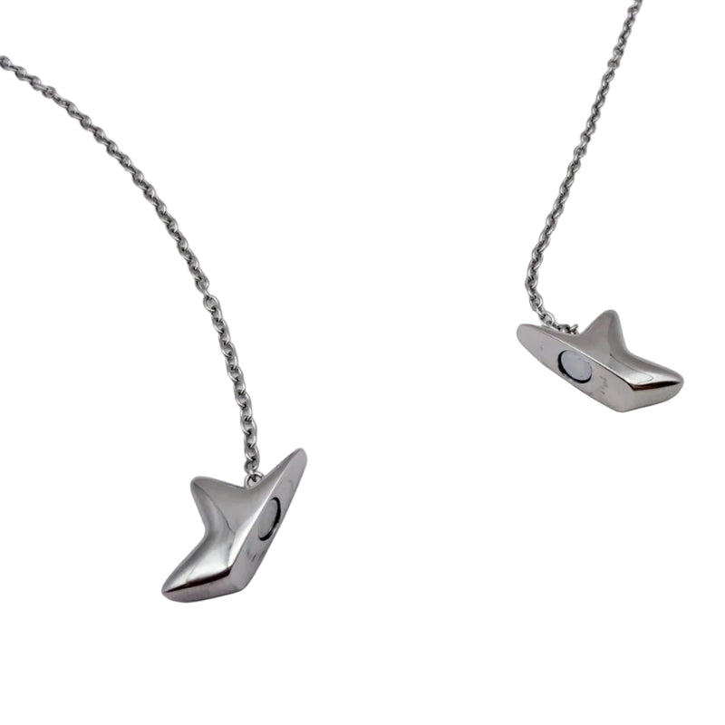 A silver-toned star shaped fidget necklace with a unique, stylized pendant shaped like a stylized bird or fish head, displayed on a clean white background.