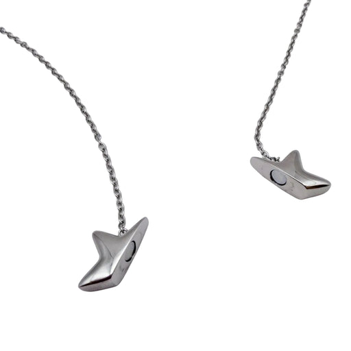 A silver-toned star shaped fidget necklace with a unique, stylized pendant shaped like a stylized bird or fish head, displayed on a clean white background.