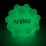 Kaiko Pop It Squishy Ball glowing green in the dark