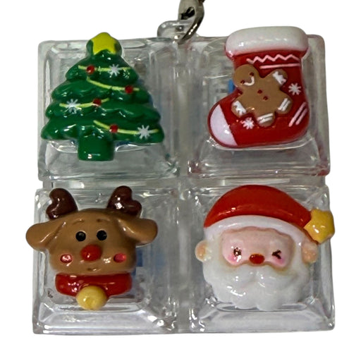Four Christmas themed keyboard keys