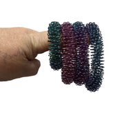 OIL SLICK Wrist Spikey - Harm Minimisation & Regulation Tool