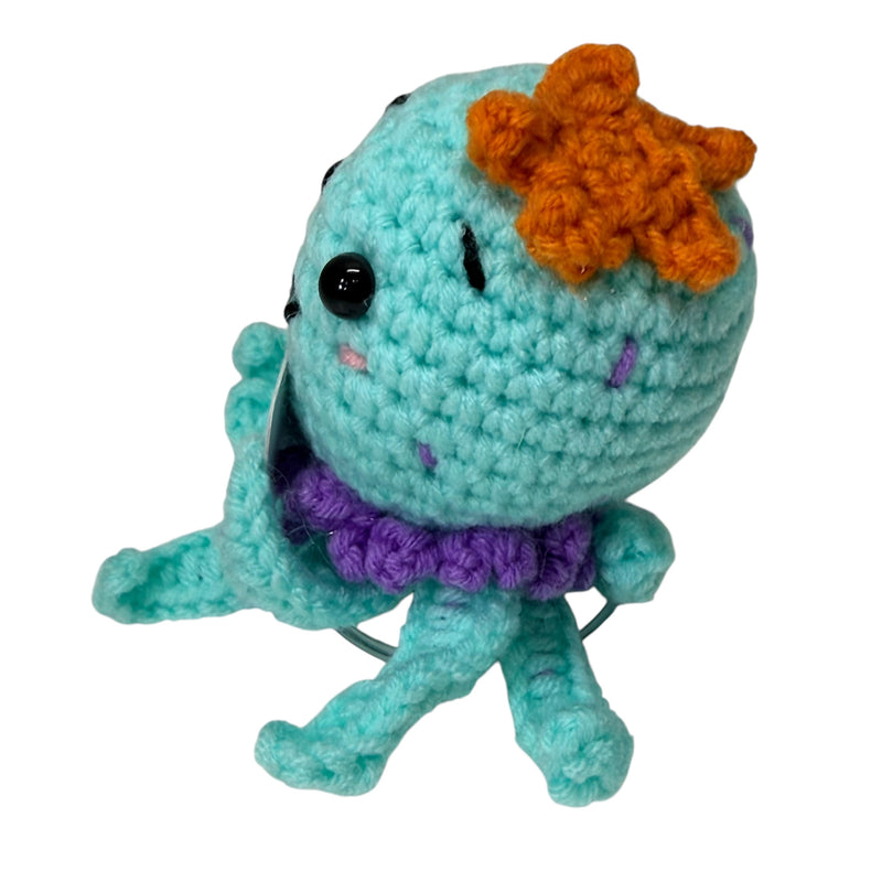 Three-quarter view of aqua Just Because You Carry It Well octopus crochet critter