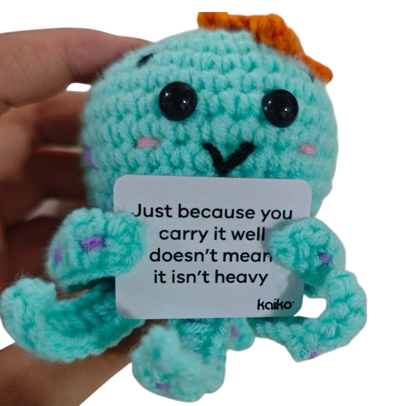 Just Because You Carry It Well octopus crochet critter held in hand for size reference