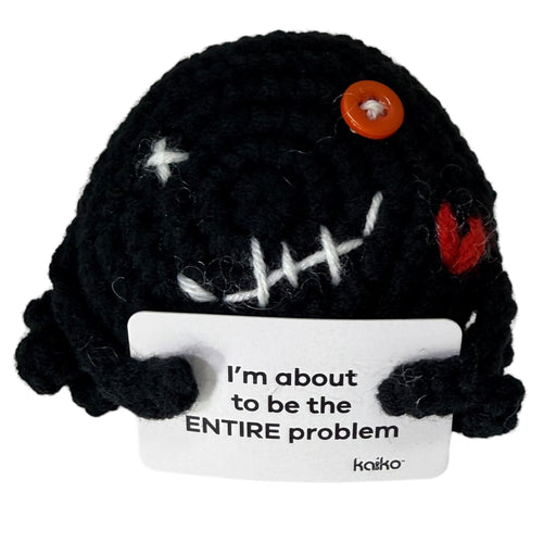 Front-facing I'm About to Be the Entire Problem black crochet critter with message
