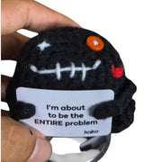 I'm About to Be the Entire Problem black crochet critter held in hand for size reference
