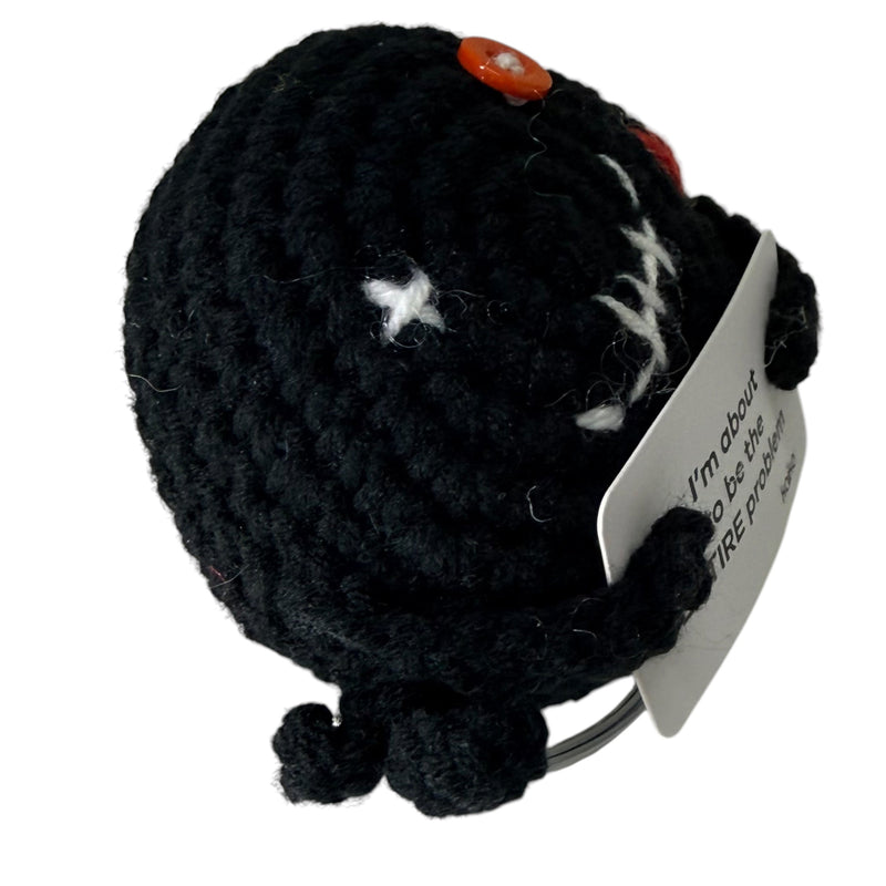 Side view of I'm About to Be the Entire Problem black crochet critter