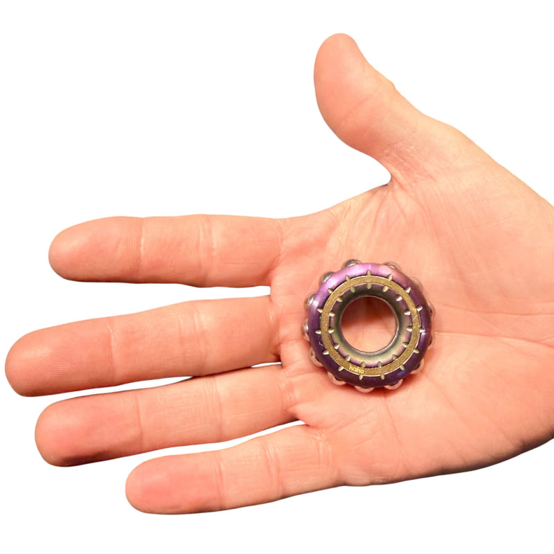 Freewheel Spinner resting in an adult hand for scale