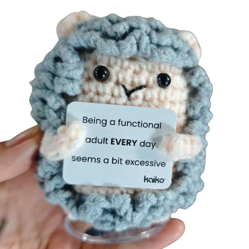 Being a Functional Adult Every Day sheep crochet critter held in hand for size reference