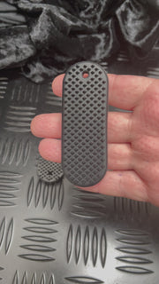 Close-up demonstration of the firm PVC SpiKEYring pad texture