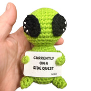 Currently on a Side Quest alien crochet critter held in hand for size reference
