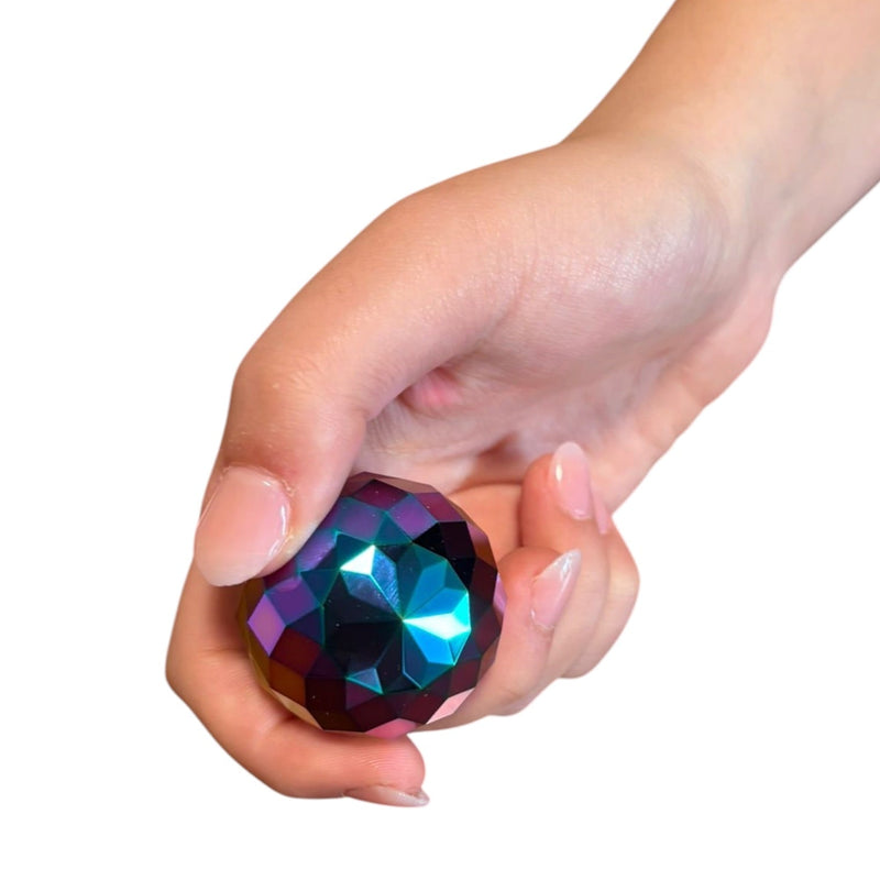 Spectra Optical Spinning Gyroscope showing its faceted surface