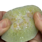 Green Vivid Stretchy Pick 'Em being picked and pressed