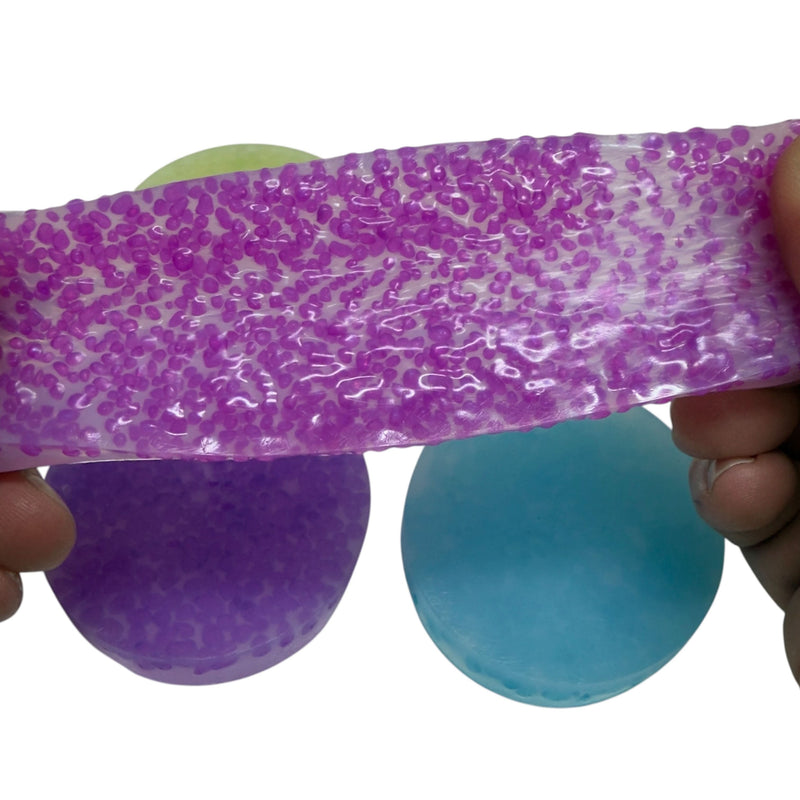Pink Vivid Stretchy Pick 'Em stretched to show embedded pebbles