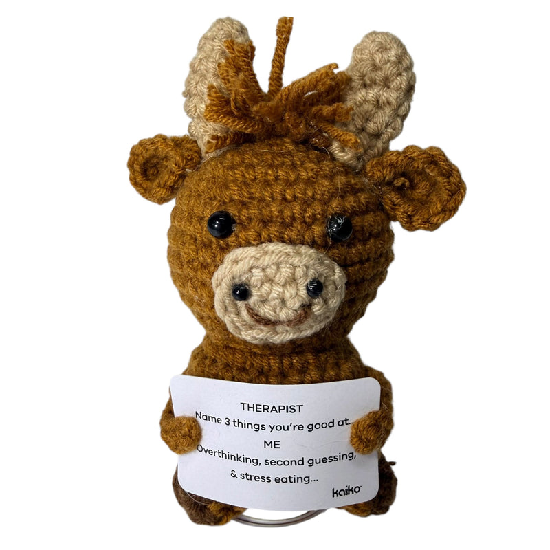 Cow crochet critter displayed on stand