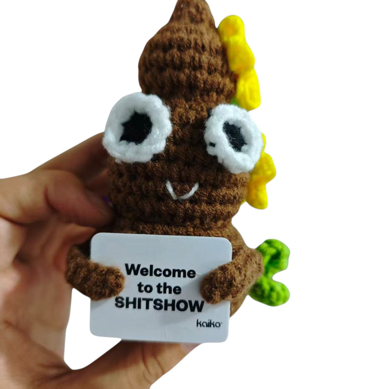 Welcome to the SHITSHOW poo crochet critter held in hand for size reference