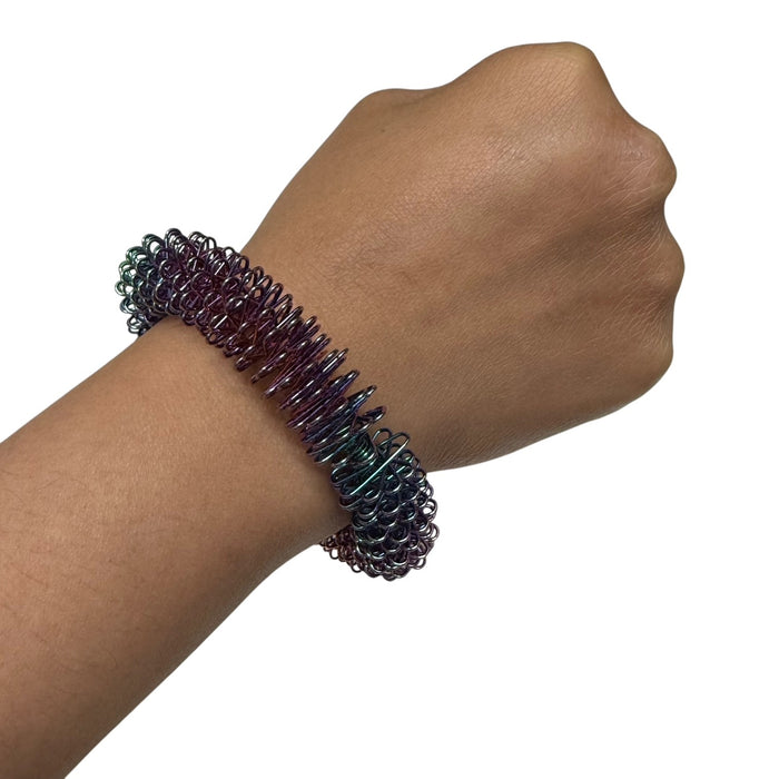 OIL SLICK Wrist Spikey - Harm Minimisation & Regulation Tool